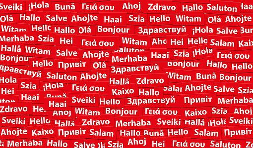 Das Wort Hallo in vielen verschiedenen Sprachen auf rotem Hintergrund